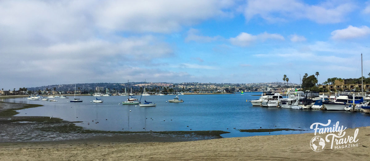 Small San Diego beach with boats docked and in the water. - post about the best things to do in San Diego