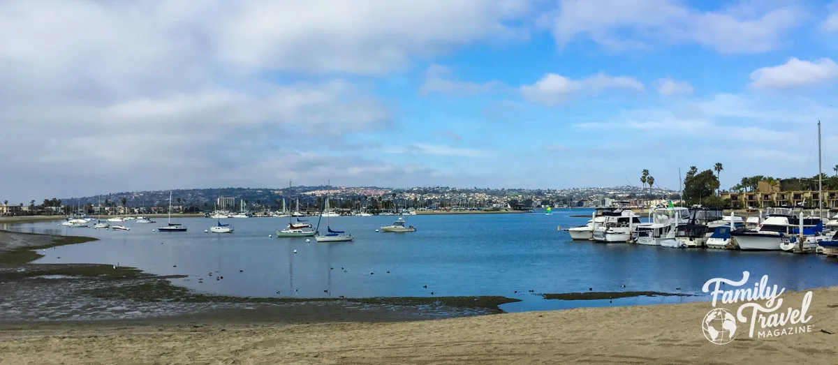 Small San Diego beach with boats docked and in the water. - post about the best things to do in San Diego