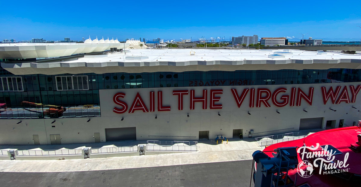 Cruise port building - terminal V -Virgin Voyages with Sail the Virgin Way written on it. 