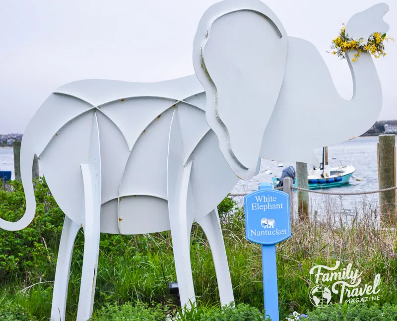 White elephant statue in front of beach