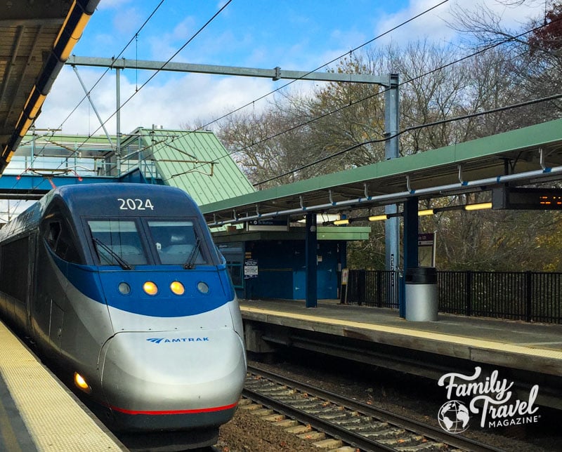 Amtrak train pulling into a station platform