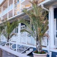 Bethany Beach Ocean Suites (one of the best Bethany Beach Hotels) along boardwalk with individual terraces for the hotel rooms