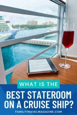 Stateroom balcony with table, eReader, and drink looking out over Atlantis