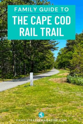 Paved path of the Cape Cod Rail Trail surrounded by trees