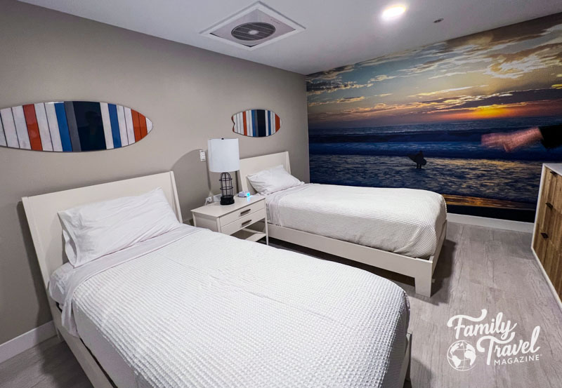 Twin beds with surfboard decor 