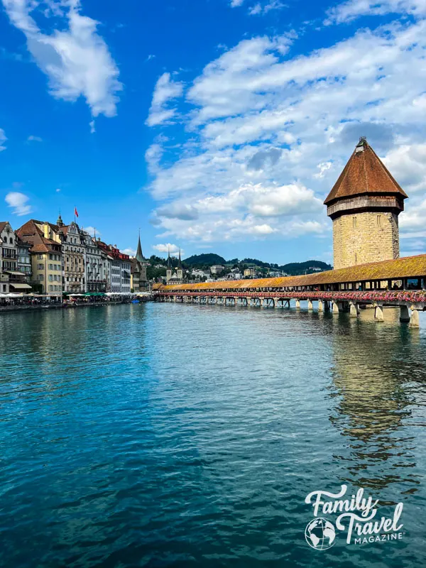 Chapel Bridge in Lucerne with buildings along the waterfront
