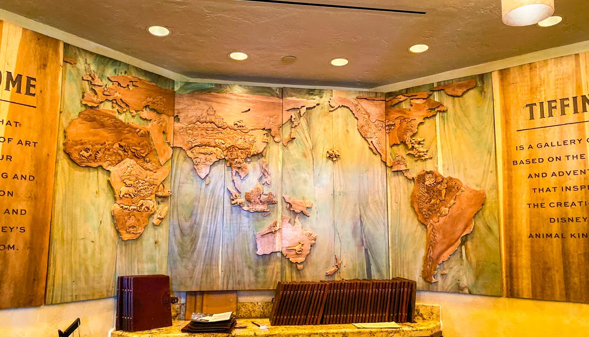 Large map mural over the check in desk at Tiffins