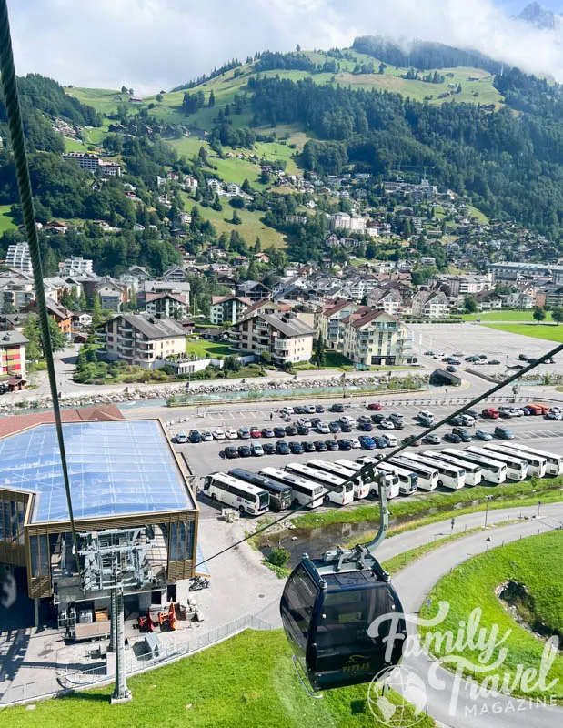 Titlis Cable Car above parking lot and town of Engelberg, taken from above 