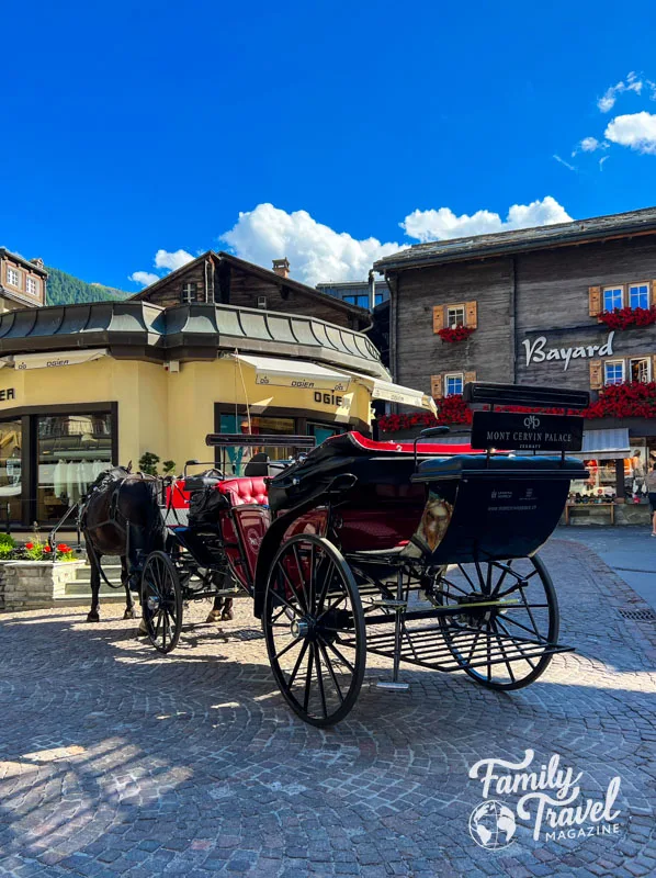 Horse and carriage in front of Zermatt shops