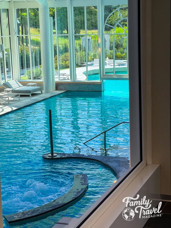 Indoor pool in glass room as viewed from above. 