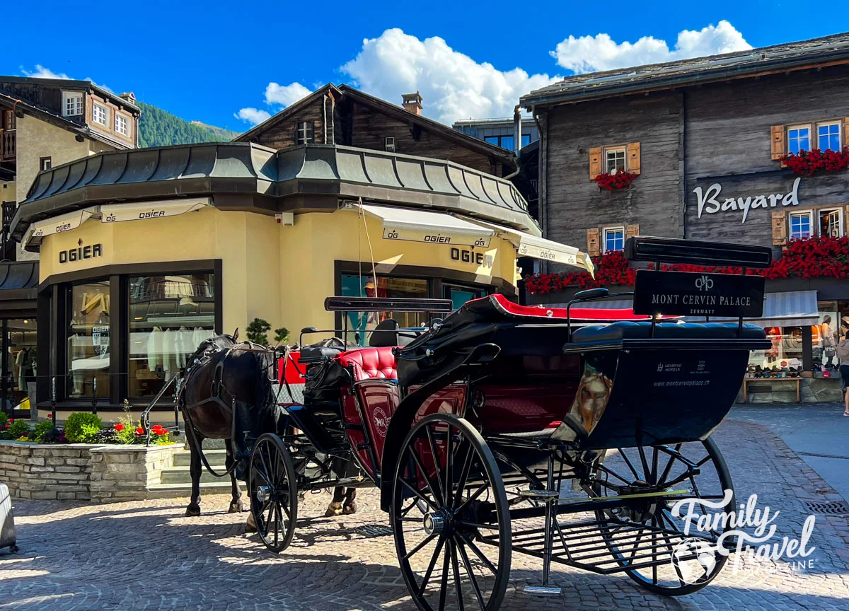 Mont Cervin Palace horse and carriage in front of shops