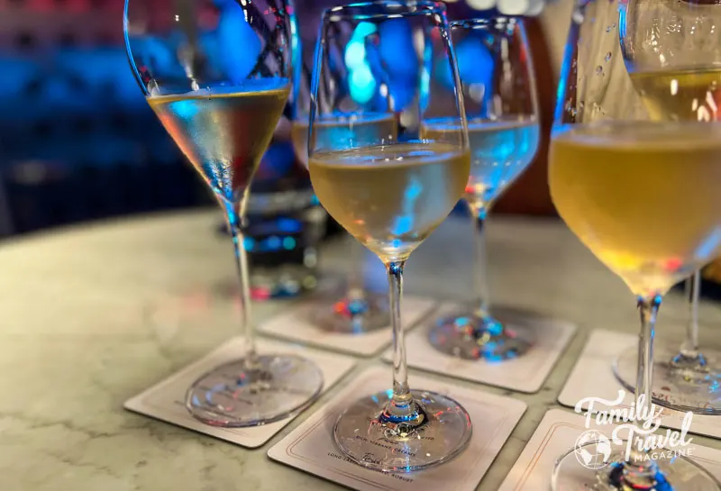 Six glasses of champagne on paper coasters