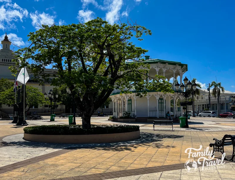 Central Park Independence Square with round building, trees, and benches