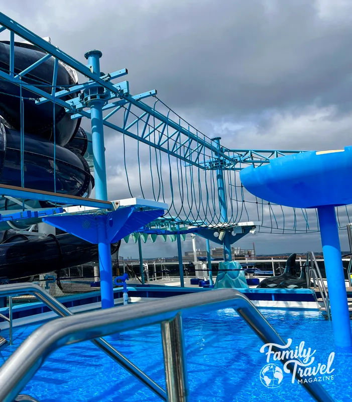 Ropes course in water park area with pool