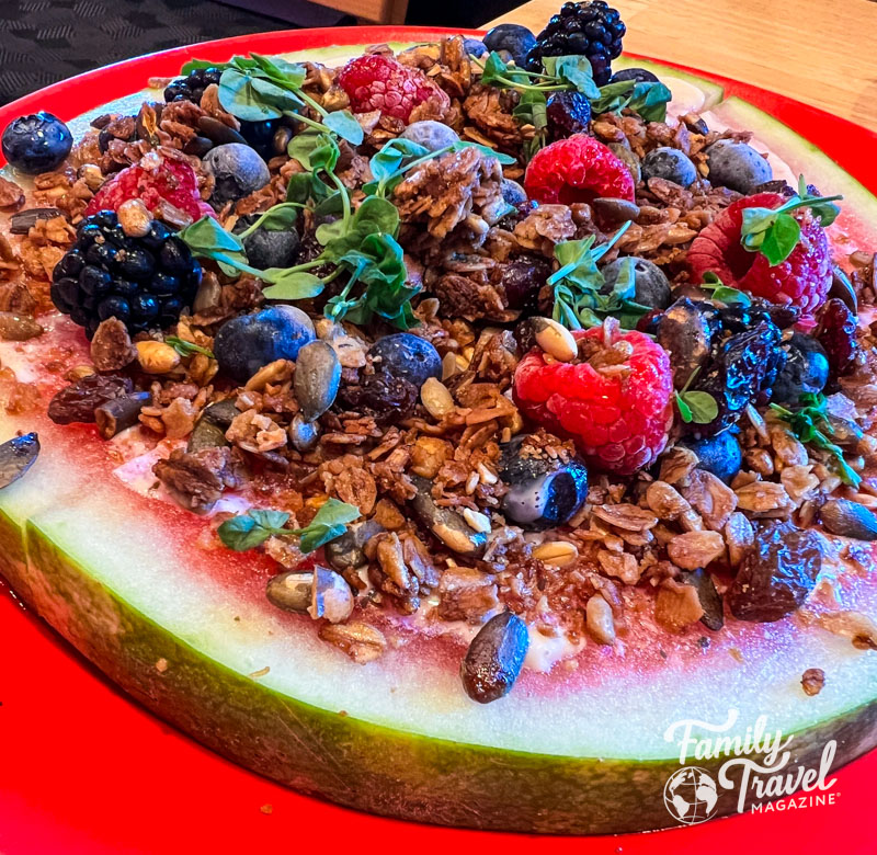 Watermelon slice with berries/granola on top