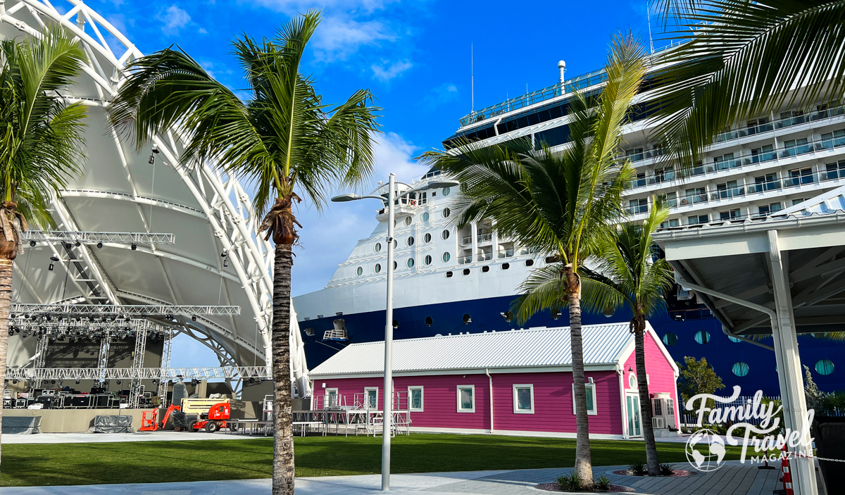 Celebrity Summit docked at Nassau with a pink building and amphitheater in the foreground. 