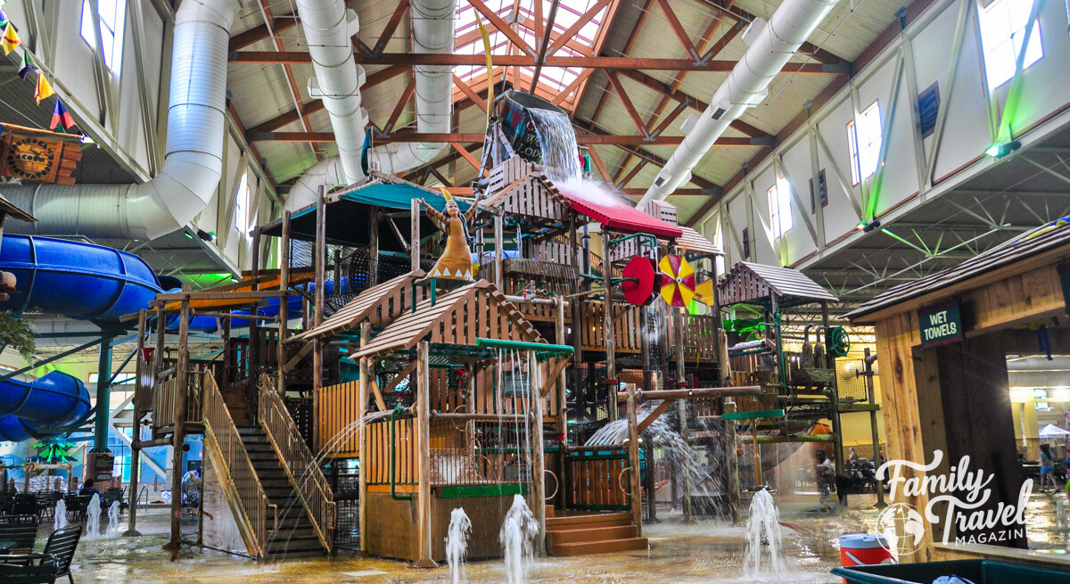 Indoor water park treehouse-style 
feature with sprays, water slides, buckets 