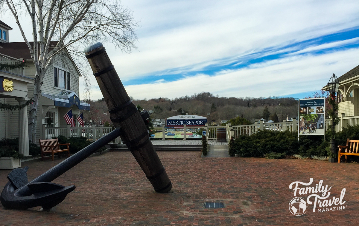 Entrance to Mystic Seaport with large anchor and pier