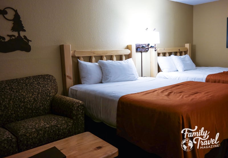 Two queen beds, sofa, and coffee table.