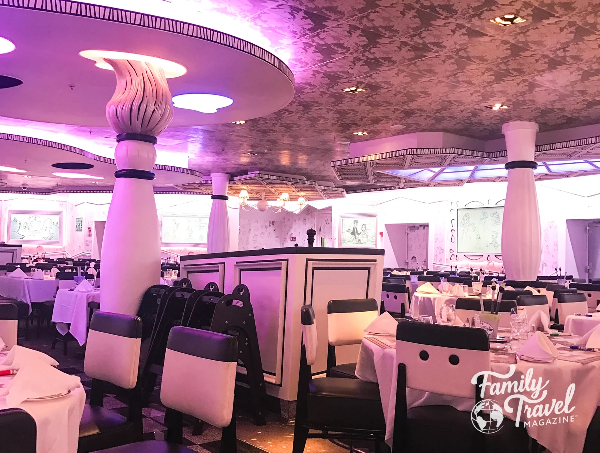 Animator's Palate dining room with paint brush columns and purple hues. along with tables and chairs. 