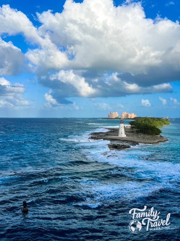 Atlantis towers with lighthouse on inlet in the foreground