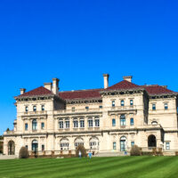 Back of the Breakers mansion with large lawn in front