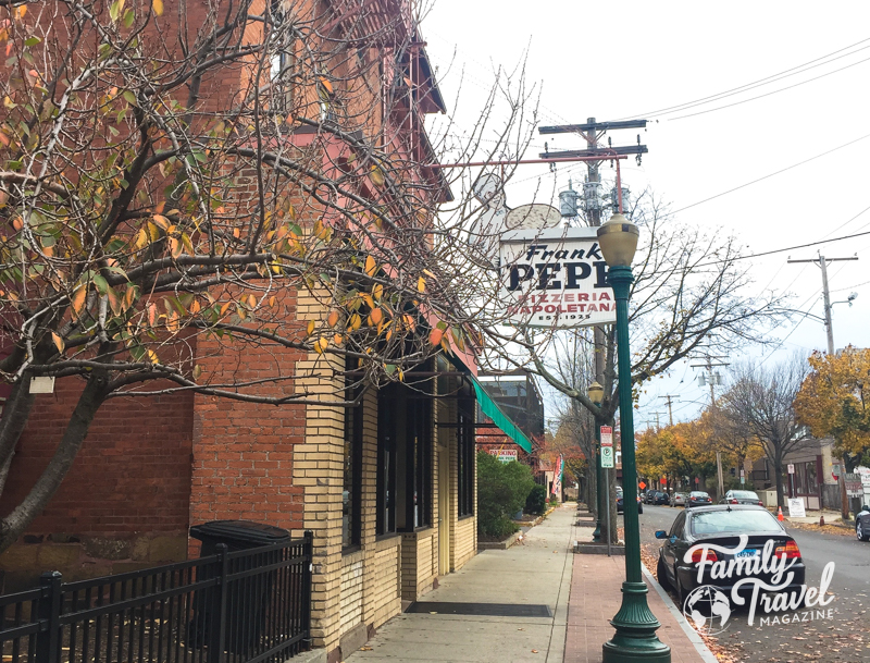 exterior of Frank Pepes - a brick building along a street. 