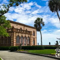 Ringling Museum exterior with palm trees and statues