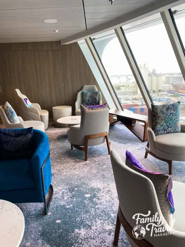 Chairs and tables in concierge lounge while ship is at port.