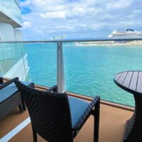 Large balcony overlooking ocean with another cruise ship