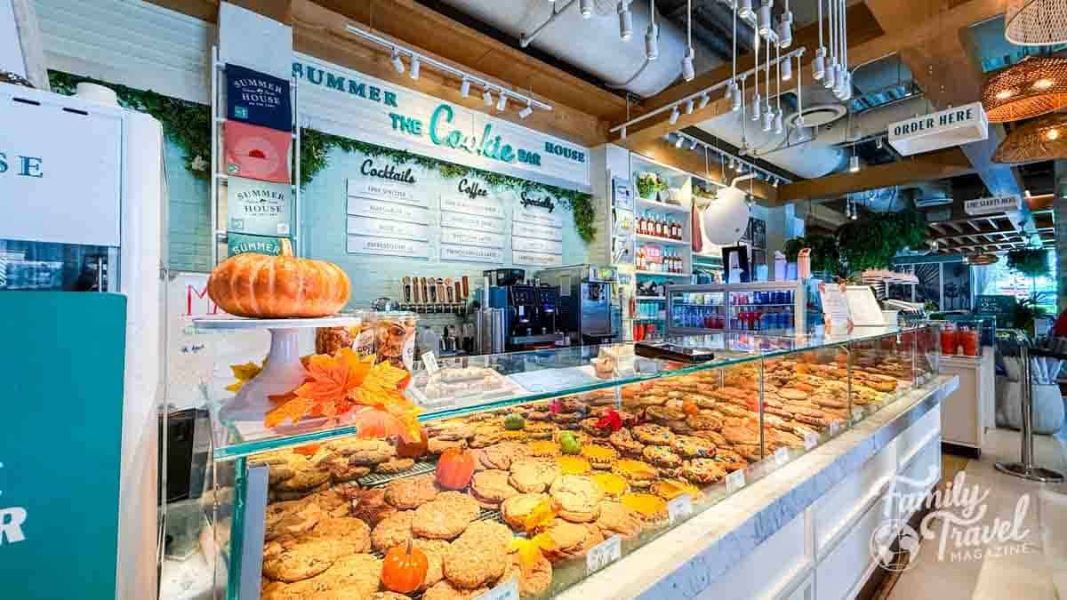 Cookie display case at Summer House bakery with fall decorations.