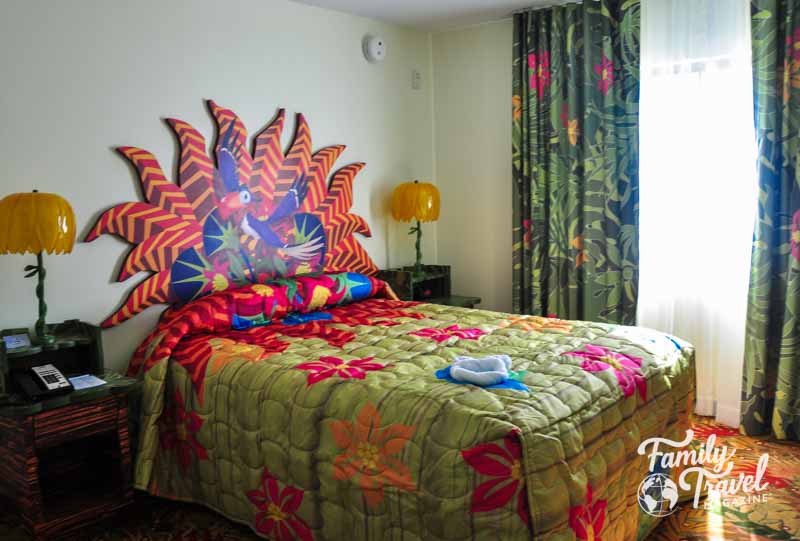 Colorful Lion King themed bedroom with one bed. 