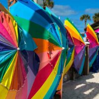 Colorful umbrellas on their sides on the beach