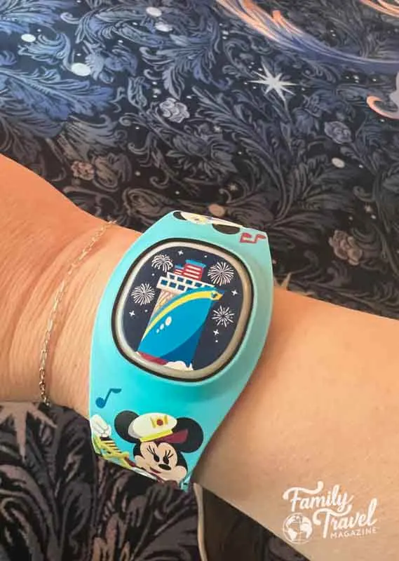 Blue cruise themed DisneyBand on wrist