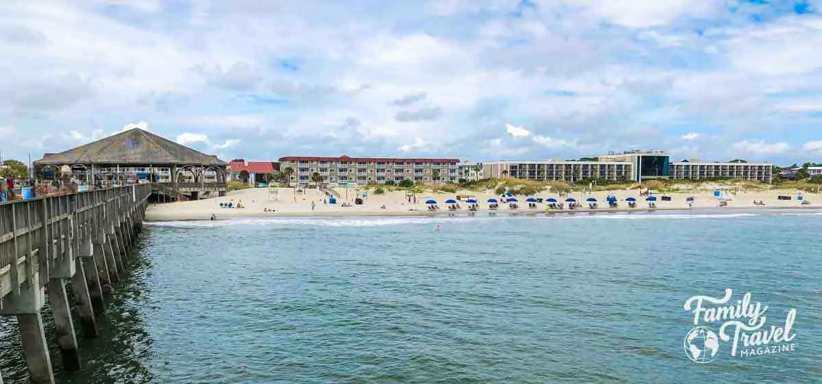 a view of the beach and pier from the boardwalk in Tybee Island Georgia