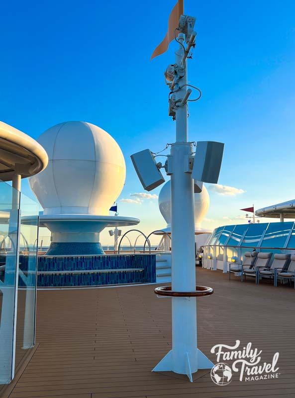 two satellites on deck of Disney Cruise with chairs and small pool