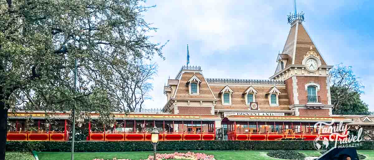 Disneyland train station with train in front. 