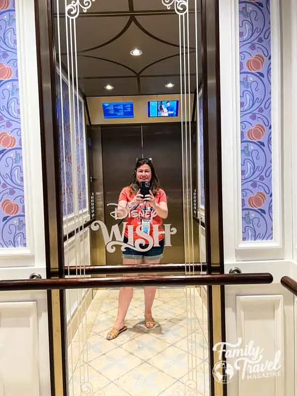 Woman taking photo in elevator
