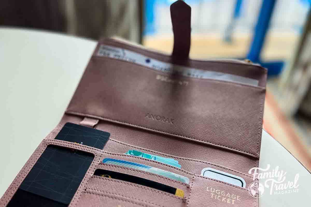 Pink travel wallet on a desk