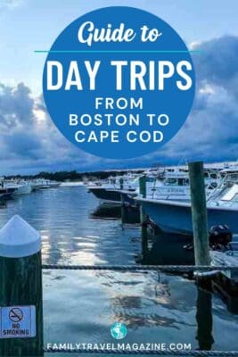 Pinterest graphic featuring a marina filled with boats under a moody evening sky, with text overlay reading “Guide to Day Trips from Boston to Cape Cod.” A wooden post with a “No Smoking” sign is in the foreground, and the Family Travel Magazine website is listed at the bottom.