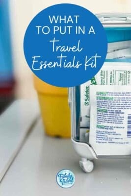 Travel essentials kit shaped like a mini suitcase filled with wipes and first aid items, with overlaid text reading “What to Put in a Travel Essentials Kit”—perfect for family vacation planning. Branded with Family Travel Magazine.