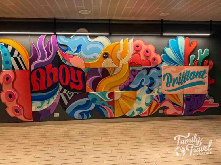 Colorful cruise ship mural with abstract sea life, tentacles, and the words “Ahoy” and “Brilliant” on Virgin Voyages’ Brilliant Lady