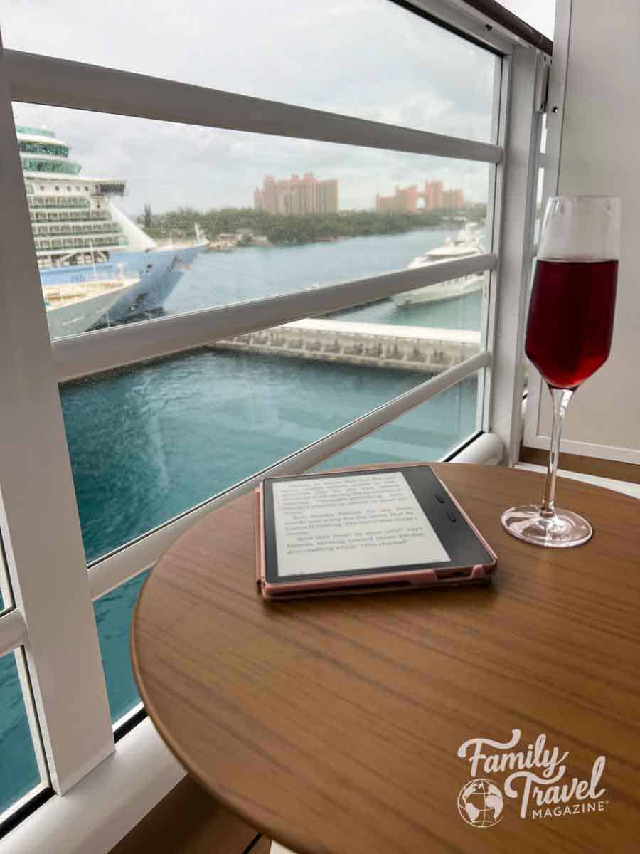Disney Cruise Line verandah with Kindle and sparkling drink overlooking Nassau Bahamas