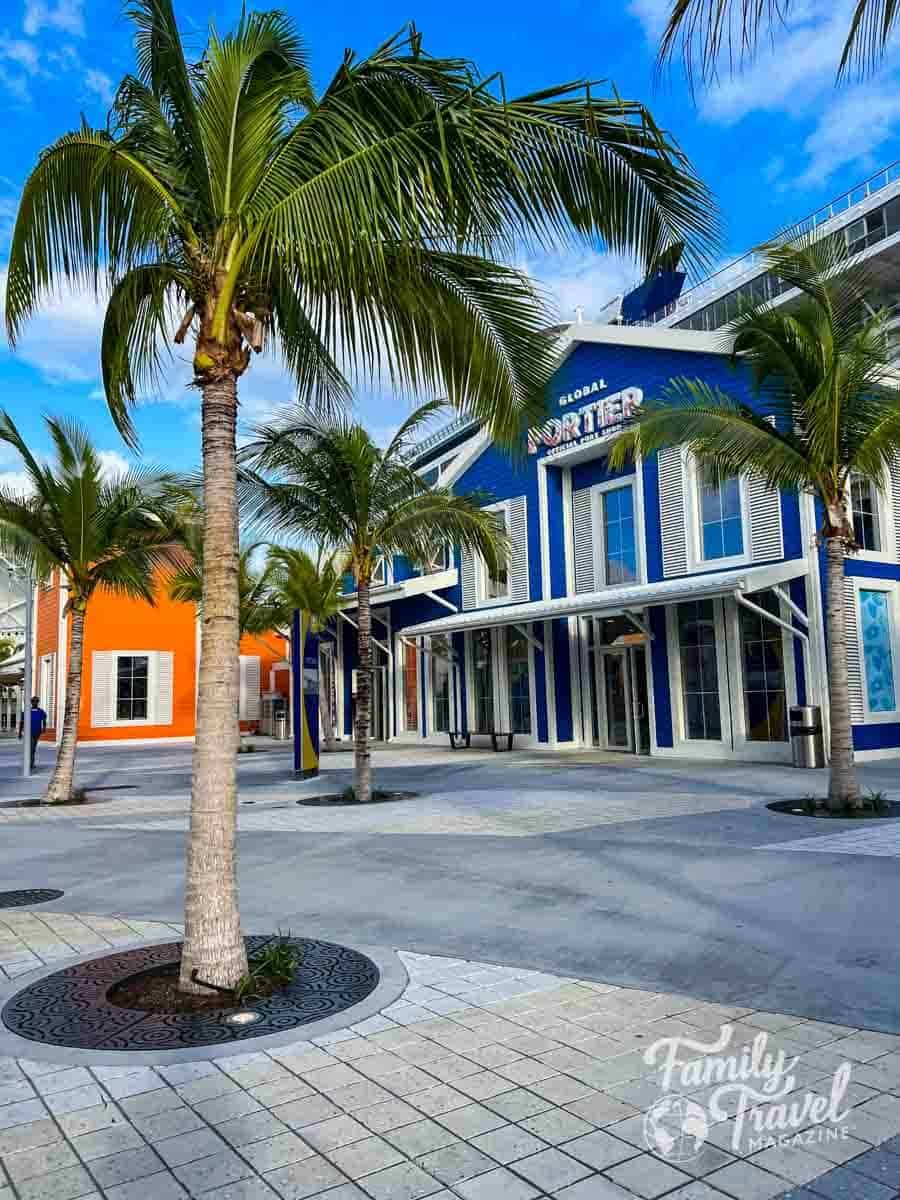 Colorful buildings and palm trees at the Nassau Cruise Port in the Bahamas, a popular Caribbean cruise destination.