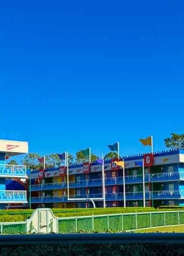 Colorful buildings and giant footballs decorate a sunny sports-themed resort.