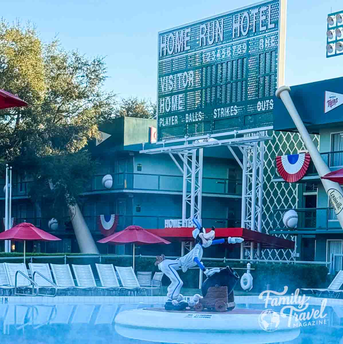 Baseball themed pool area with scoreboard and Goofy statue.