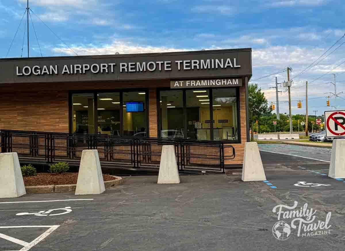 Exterior of the Logan Airport Remote Terminal at Framingham under a cloudy sky.