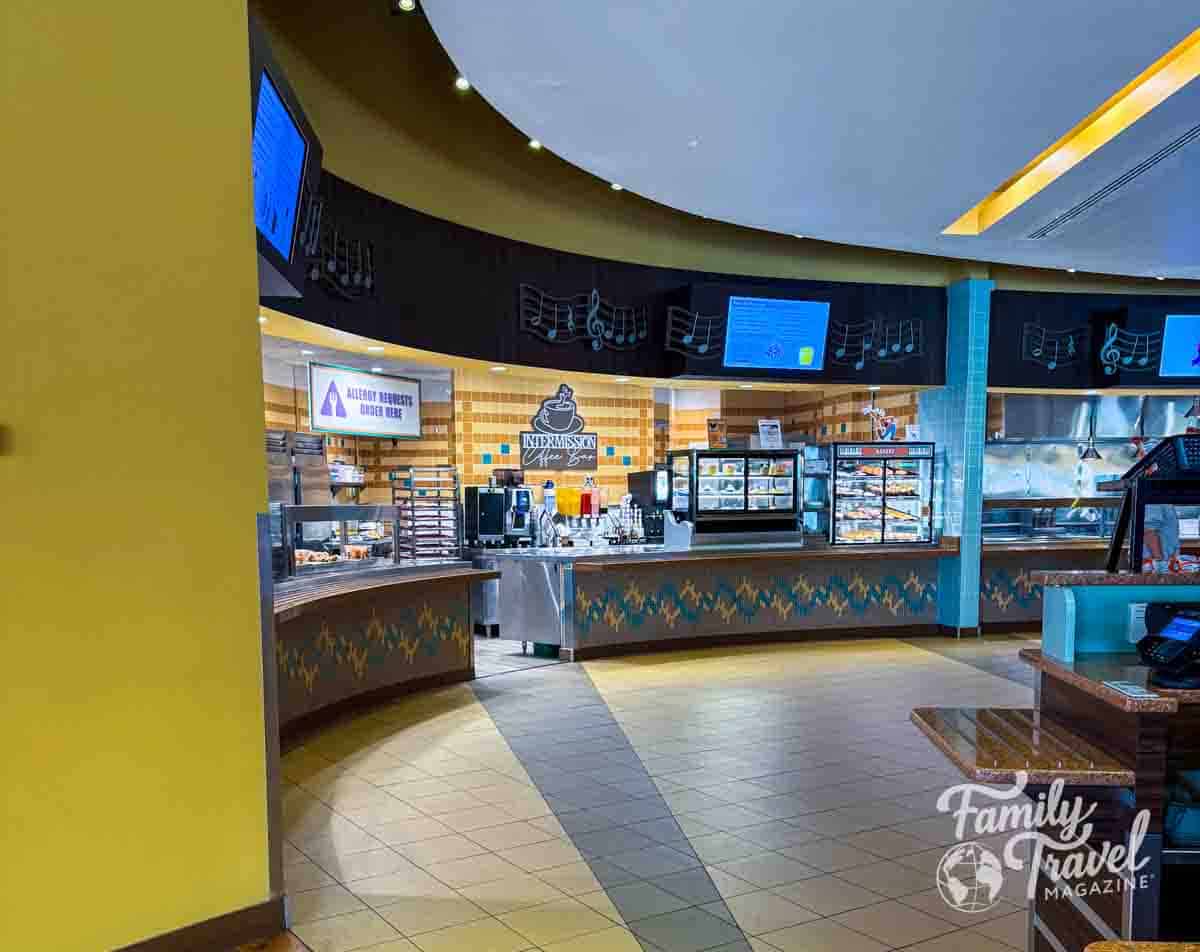 Intermission Food Court at Disney’s All-Star Music Resort with serving stations, beverage area, and music note decor