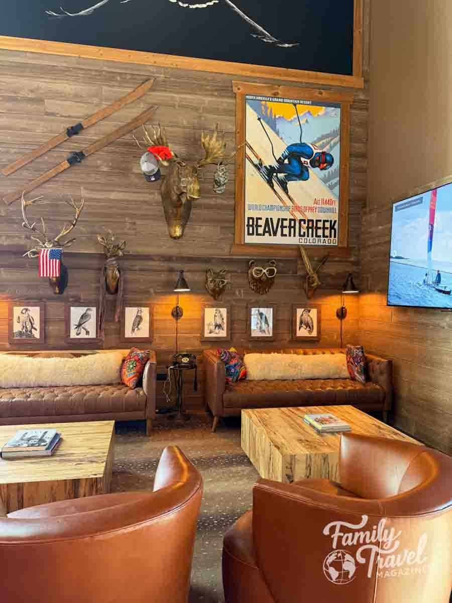 Hawks Nest rustic teen's club lobby lobby at Beaver Creek, Colorado, featuring mounted animal heads and vintage ski decor.