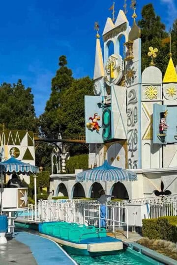 The iconic its a small world attraction at Disneyland, featuring its clock tower and boat ride.